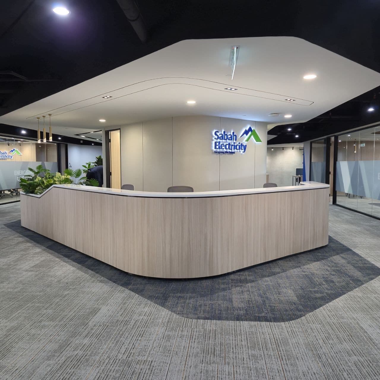 Sabah Electricity (SESB) — curved timber reception desk